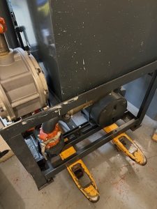 Ferens Elevator Service technician using forklift truck to move elevator equipment, Poughkeepsie NY